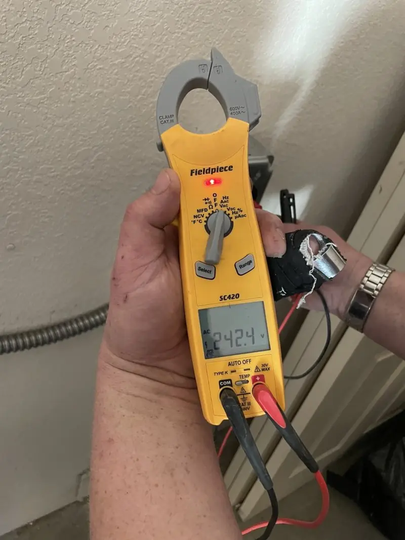 Voltage testing with clamp meter during Electrical Installation Services in Leisure City